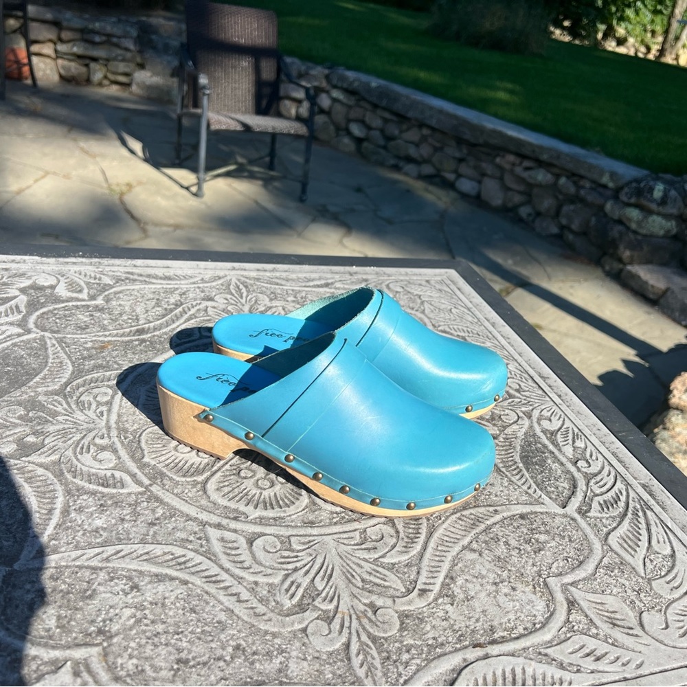 Bright robins egg blue wooden clogs by Free People size 41